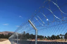 A flat concertina on a chain link fence